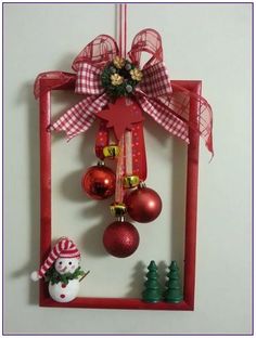 a red frame with ornaments hanging from it