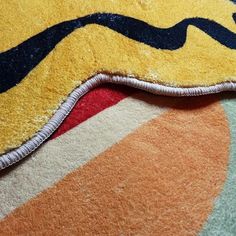 a close up of a colorful rug on the floor