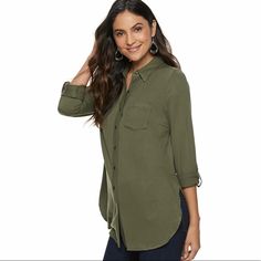 Vented Tunic Shirt Vented Hem 1-Pocket Button Front Button Tab Sleeves Roll From Long To 3/4-Length Jersey Construction Rayon, Spandex Machine Wash Color: Grape Leaf Casual Business Blouse With Placket, Khaki Workwear Top With Buttoned Pockets, Casual Green Office Blouse, Casual Blouse With Buttoned Pockets And Shirttail Hem, Khaki Casual Top For Business Casual, Casual Button-up Blouse For Work, Casual Office Blouse With Placket, Casual Office Blouse With Rolled Sleeves, Casual Office Blouse With Pockets