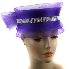 Introducing our exquisite 243HB Church Hat, the perfect accessory to complete your Sunday attire. This stunning piece is not just a testament to timeless fashion but also embodies elegance and sophistication. Our church hat is carefully curated to ensure that you stand out with grace and poise at any gathering, especially during religious services and special occasions. Expertly crafted with attention to detail, the 243HB Church Hat showcases a unique and vibrant purple hue that brings a touch o Classic Brimmed Mini Hats For Party, Classic Mini Hats With Short Brim For Party, Chic Mini Hat With Structured Crown For Church, Elegant High Crown Hats For Formal Occasions, Elegant High Crown Top Hat For Party, Classic Hats For Royal Ascot Party, Formal Cloche Hat For Royal Ascot, Classic Cloche Hat With Curved Brim For Party, Elegant Cloche Top Hat For Church