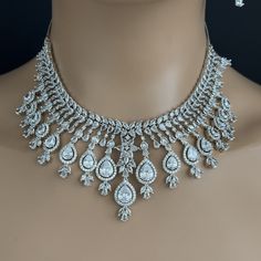 White CZ diamond bridal necklace, American Diamond wedding necklace, Cz jewelry, Indian, Pakistani, Punjabi wedding jewelry Regular Size And Adjustable with rhodium finish Ships from California, USA Delivery in 2-5 business days in the USA. Other colors can be found here https://www.etsy.com/listing/1423097794/sapphire-cz-diamond-bridal-necklace?ref=listings_manager_grid https://www.etsy.com/listing/1423095388/emerald-cz-diamond-bridal-necklace?ref=listings_manager_grid Color, shades, and textur White Gold Bridal Necklace With Elegant Crystal Design, Wedding Crystal Diamond Necklace With Elegant Design, Diamond White Necklaces For Wedding, Silver Diamond Necklace With Sparkling Stones For Wedding, Silver Jewelry With Diamond Accents For Marriage, Dazzling Jewelry With Diamond Accents For Marriage, Dazzling Jewelry With Diamond Accents For Wedding, Wedding Bridal Necklace With Hand Set Diamonds, Silver Bridal Necklace With 17 Jewels In Cubic Zirconia