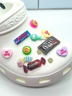 a white shoe with candy and candies on it