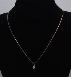 Lovely vintage marquise cut colorless cubic zirconia on a gold tone metal pendant, set on a gold tone chain necklace.  Pendant - 1/2 x 3/8" - Marked "(illegible)" Chain - 18 inches long - UNMARKED Warwick Ny, Metal Pendant, Marquise Cut, Pendant Set, Last Minute Gifts, Gold Tone Metal, Necklace Pendant, Pendant Necklaces, Cubic Zirconia