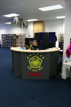 a person sitting at a desk in an office