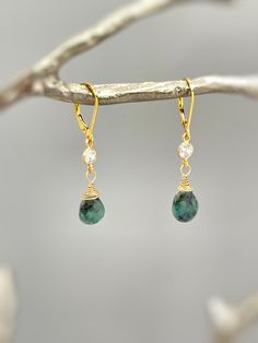 Genuine Emerald Earrings. Dainty handmade crystal dangle tear drop earrings.  Dainty raw emerald gemstone tear drops are wire wrapped in 14k gold fill or sterling silver and hang from sparkling bezel set crystals. Matching French hook or leverback earring backs available. Gemstone drops are dainty approx 8x9mm. Simple, elegant everyday earrings. Lightweight elegant earrings.  Emeralds are organic in nature and contain some color variations and inclusions. Please see photo for some examples. Emer Everyday Green Teardrop Pendant Jewelry, Green Teardrop Pendant Jewelry With Matching Earrings, Adjustable Drop Jewelry With Natural Stones, Elegant May Birthstone Long Drop Jewelry, Elegant Long Drop May Birthstone Jewelry, Fine Jewelry Teardrop Pendant Earrings As Gift, Fine Jewelry Teardrop Earrings For Gift, Sterling Silver Teardrop Crystal Earrings With Natural Stones, Elegant Dangle Teardrop Earrings With Natural Stones