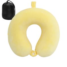 an inflatable travel pillow with a black bag next to it on a white background