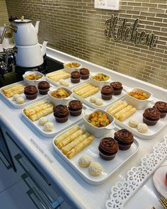 there are many different desserts on the counter