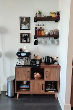 a coffee bar with various items on the shelves and below it is a wall mounted shelf