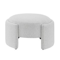 a white ottoman that is sitting on top of a table