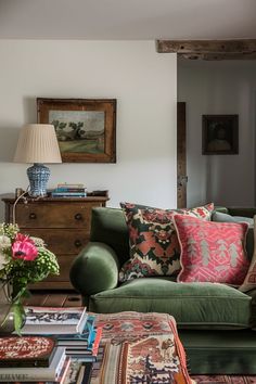 a living room filled with furniture and lots of pillows