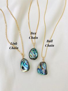 Abalone Shell Pendant Necklace These stunning necklaces are eye-catchers! Features all natural Abalone Shells in random freeform shapes. No two pendants will be exactly alike as they are all natural. Each hangs on your choice of chain. All components are gold filled. Chain Options: Gold Filled Link Chain Gold Filled Box Chain Gold Filled Ball Chain Chain Length Options: 18 inches 20 inches 22 inches 24 inches Can't decide on a length? Purchase a 2-inch chain extender to add to your necklace for Gift Shell Necklace With Lobster Clasp, Adjustable Shell Necklace With Lobster Clasp For Gift, Shell Necklaces With Lobster Clasp For Gifts, Bohemian Shell Charm Necklace As Gift, Ocean-inspired Abalone Shell Necklace As Gift, Adjustable Abalone Shell Necklaces As Gift, Bohemian Shell Charm Necklace For Gift, Shell Charm Necklace, Abalone Necklace