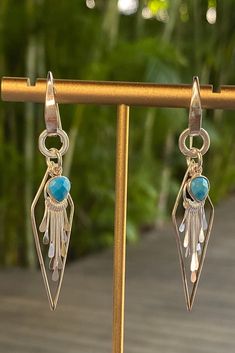 Inspired by the vibrant and serene waters of Key West, these Sterling Silver Earrings showcase stunning turquoise pendants. The fan tassels gracefully sway, mimicking the gentle movement of waves, while adding a playful and bohemian touch to your look. Gentle Movement, Pink Tassel Earrings, Key West Fl, Earrings Handmade Dangle, Fan Earrings, Blue Quartz, Pink Quartz, Sterling Silver Hoops, Turquoise Pendant