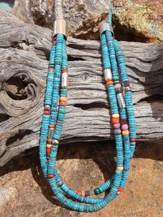 This is a beautiful Handcrafted Native American Made single strand to triple strand heishi necklace. Each necklace is entirely Handcrafted which makes it a ONE OF A KIND you get the exact necklace shown in the pictures. The necklaces that I sell are meticulously crafted by Native American bead workers, and the quality and attention to detail is truly exceptional. The necklace measures about 30" (end to end) bead length is 27" it has a Sterling Silver toggle clasp closer.  The Kingman Turquoise is gorgeous blue and Multi Colored mix of Gemstones the hand stamped Sterling Silver beads add a very rich look to this work of art. I personal own one of these and it is my favorite necklace the colors are stunning and go with almost every outfit. I have gotten so many complainants on this necklace. Turquoise Multi-strand Hand-strung Jewelry, Southwestern Multi-strand Turquoise Jewelry, Turquoise Double Strand Hand-strung Jewelry, Hand-strung Multi-strand Turquoise Necklace Gift, Artisan Double Strand Turquoise Jewelry, Turquoise Multi-strand Gemstone Beads Jewelry, Double Strand Turquoise Jewelry With Colorful Beads, Turquoise Double Strand Polished Bead Jewelry, Turquoise Double Strand Jewelry With Colorful Beads