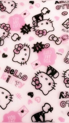 a bunch of hello kitty stickers on top of a white sheeting with pink and black designs