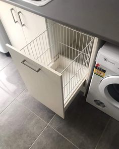 a white dishwasher sitting next to a washing machine