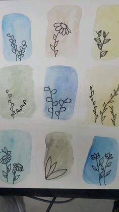 an art project with watercolors and ink on paper, depicting different types of flowers