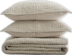 three pillows stacked on top of each other