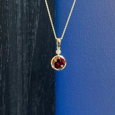 Photo of Garnet and Diamond Pendant in a decorative scene, designed by , available at Plumb Gold & Plumb Silver Gemstone Necklace Pendant, Yellow Gold Pendants, Gemstone Necklace, Diamond Pendant, Gold Pendant, Earring Set, Garnet, Gold Jewelry, Yellow Gold