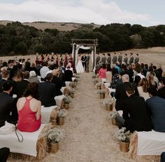 a wedding ceremony in the middle of a field