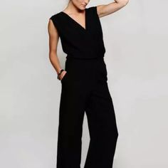 Black Jumpsuit With Deep V-Neck, Elastic Waist, Zip Up Back, And Functioning Pockets. Never Worn But Without Tags. Versatile Fitted V-neck Jumpsuits And Rompers, Versatile Fitted V-neck Jumpsuit, Black V-neck Jumpsuits For Summer, Black V-neck Jumpsuits And Rompers For Spring, Fitted Black V-neck Pantsuit, Casual Black Pantsuit For Night Out, Versatile Black V-neck Jumpsuits And Rompers, Casual V-neck Jumpsuits And Rompers For Work, Black Summer Workwear Pantsuit