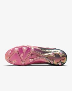 a pink and gold shoe with white soles on the bottom half of its heel