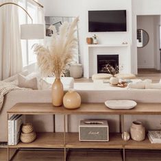 a living room filled with furniture and a fire place