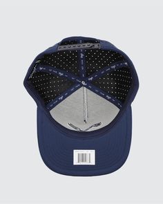 the new era snapback hat in navy and grey with white polka dots on it