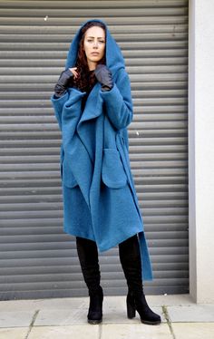 "Hooded Wool Coat, Winter Wool Coat, Dark Blue Coat Turquoise coat. Autumn-winter loose coat. Wool hooded maxi coat. Oversize wool jacket. Handmade item. The coat has a viscose lining. Two pockets, warm hood. Black 100% wool, best quality wool coat . Casual and warm, cozy and very comfortable . You can wear it in winter in warmer days, and in autumn and winter. Model wearing size : SIZE S Color : Turquoise SIZE S (US 6, UK 10, Italian 40, French 38, German 36, Japan 7) bust: fits bust around 35. Blue Winter Sweater Coat With Pockets, Oversized Long Blue Outerwear, Oversized Blue Hooded Jacket With Pockets, Blue Oversized Hooded Outerwear, Oversized Winter Coat, Dark Blue Coat, Halloween Jacket, Hooded Wool Coat, Coat Plus Size