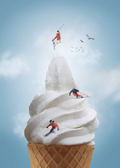 an ice cream cone with two skiers on top and birds in the sky above