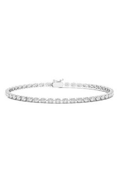 Oval-cut lab-grown diamonds are prong-set along this distinctive tennis bracelet. Total lab-grown diamond weight: 6.20ct. Color: D-F Clarity: EX-VS 14k gold/lab-grown diamond Made in the USA >Diamond Guide Oval Diamond Tennis Bracelet For Anniversary, Luxury Oval Diamond Tennis Bracelet, Elegant Oval Tennis Bracelet With Single Cut Diamonds, Classic Oval Diamond Bracelet With Accents, Oval Brilliant Cut Diamond Tennis Bracelet, Oval Tennis Bracelet With Prong Setting For Anniversary, Classic Oval Tennis Bracelet For Anniversary, Oval Brilliant Cut Tennis Bracelet For Anniversary, Timeless Oval Diamond Tennis Bracelet