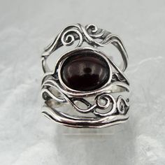 "Stunning NEW band from Hadar \"Nets\" Collection. The ring is made of 925 sterling silver with oval 8mm X 10mm Garnet stone Dimensions: Front Width: 23mm / 0.905 in., Back width: 6mm / 0.236 in. Size: 8 Stamped 925. This beauty will be sent to you in a gift package. All stains, if are any, are due to camera. Please feel free to contact us at any matter. Thank you for looking. Please see my other items in this shop: http://www.etsy.com/shop/jewela To see more designs you are welcome to visit our Silver Oval Cabochon Ruby Ring As Gift, Silver Garnet Ring Stamped 925, Oval Garnet Ring In Silver, Silver Garnet Ring, Garnet Wedding Rings, Round Pearl Earrings, Garnet Wedding, Wedding Rings Art, White Pearl Ring