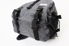 the back side of a backpack with straps and webbs attached to it, on a white background