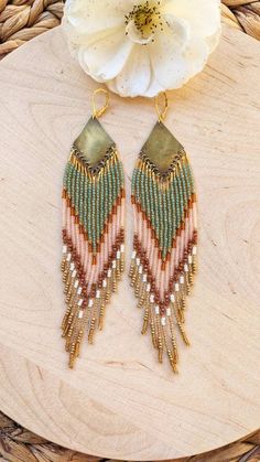 ♀ Bohemian Native American-inspired beaded earrings handmade with glass beads, sandstone, and brass.  ♀ Drop Length: 6 in. ♀ Beads: Toho, Miyuki, Czech ♀ Ear wire: 18k gold-plated brass ♀ Thread: Nylon ♀ Made to order, ships within 2-3 weeks. Get 20% Off! Click on the link below and enter ETSY20 during checkout: https://moonandmilk.com/products/sade-green-pink-sunstone-beaded-earrings?_pos=2&_sid=4321abc20&_ss=r Gold Bohemian Beaded Earrings With Faceted Beads, Beaded Dangle Earrings In Brass, Bohemian Brass Beaded Earrings With Tiny Beads, Multicolor Beaded Brass Earrings, Unique Brass Beaded Earrings With Round Beads, Artisan Long Drop Beaded Earrings, Artisan Brass Jewelry With Tiny Beads, Handmade Bohemian Brass Beads, Handmade Brass Beaded Earrings With Round Beads