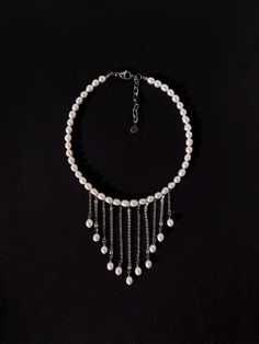 ON MODEL: - Total strand length is 14" All sizes: 12 inch - 30 cm 14 inch - 36 cm 16 inch - 41 cm 18 inch - 46 cm 20 inch - 51 cm The length of the longest chain pendant is 4.3 inch - 7 cm Add a touch of elegance with our Drop Rhinestone Pearl Necklace with chain pendants. This pearl choker features lustrous freshwater pearls that elevate any look. Designed as a pearl necklace and pearl drop necklace, this chunky necklace is a unique necklace perfect for making a statement. As a statement neckla Silver Prom Necklace, Pearls Chains, Classic Pearl Necklace, Prom Necklaces, Pearl Drop Necklace, Rhinestone Chain, Statement Choker, Unique Necklace, Pearl Choker