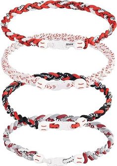 three different bracelets with red and white braiding on each strand, one in the middle