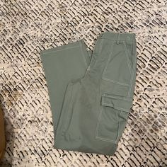 Green Cargo Pants Never Worn Size M Spring Green Cargo Work Pants, Green Work Pants With Pockets For Spring, Green Straight Cargo Jeans For Spring, Green Cargo Wide Leg Pants For Spring, Green Wide Leg Pants With Cargo Pockets For Spring, Mid-rise Green Cargo Jeans For Spring, Spring Mid-rise Wide Leg Pants With Cargo Pockets, Mid-rise Wide Leg Cargo Pants For Spring, Spring Green Cargo Jeans For Workwear