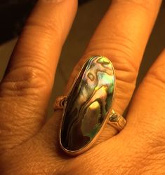 Handmade Abalone Ring. Handmade abalone and solid sterling silver statement ring. This truly one of a kind artesian ring has a beautifully etched band and is a size 9 1/2. The beautiful bezel set abalone shell measures 32mm or 1-1/4 inches at its longest point. Additional shell options are available that I can custom make in your size, please choose at checkout. This very versatile ring is sure to be every beach lovers go to statement piece. Thanks for supporting handcrafting. Abalone Ring, Statement Ring Silver, Ring Unique, Abalone Shell, Statement Ring, Rings Statement, Unique Rings, Ring Gift, Statement Rings