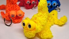 four crocheted toy animals with googly eyes, one yellow and one red