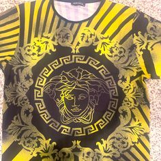 Labeled Xxl But Runs Small Designer Black T-shirt For Summer, Black Crew Neck Tops With Exclusive Print, Gold Crew Neck Top With Logo Print, Black Casual Tops With Exclusive Print, Designer Yellow Short Sleeve Tops, Designer Black Top With Graphic Print, Designer Black Tops With Graphic Print, Versace Tops, Shirt Color