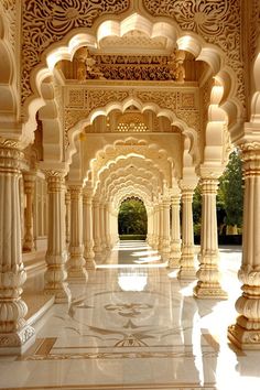 the inside of an ornate building with columns and arches on both sides, in india