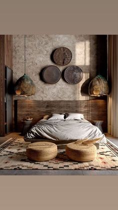 a large bed sitting on top of a wooden floor next to two round stools