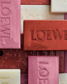 several different colored soaps with the word loewf written on one of them