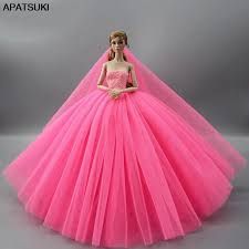 the barbie doll is wearing a pink dress