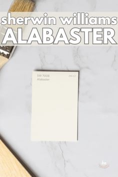 a paint brush and some white paper on a table with the words sherylin williams's ababaster