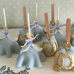 there are some cake pops decorated like princesses