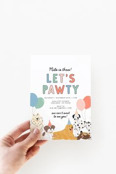 a person holding up a card with dogs on it that says, make a wish let's pawty