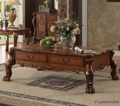 a wooden coffee table sitting on top of a rug