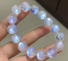 Material:moonstone beads size :Approx 11mm   quantity: one strand  6mm approx 29 pcs one strands 7mm approx25 pcs one strands 8mm approx 22 pcs one strands 9mm approx 21pcs one strands 10mm approx 19 pcs one strands 11mm approx 18pcs one strands 12mm approx 16 pcs one strands 13mm approx 16 pcs one strands 14mm approx 15 pcs one strands 15mm approx 14pcs one strands 16mm approx 14 pcs one strands 17mm approx 13pcs one strands 18mm approx 13pcs one strands 19mm approx 12pcs one strands 20mm appro Moonstone Crystal Bracelet With Round Beads As Gift, Moonstone Gemstone Beaded Bracelets With Round Beads, Moonstone Gemstone Beaded Bracelets, Moonstone Crystal Bracelet With 8mm Round Beads, Moonstone Beaded Bracelets With Gemstones, Moonstone Crystal Bracelet With Round 8mm Beads, Hand-strung Moonstone Crystal Bracelet, Moonstone Gemstone Beads Crystal Bracelet, Moonstone Crystal Bracelet With Gemstone Beads