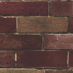 a red brick wall that is very close to the ground