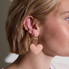 We're all hearts for this arrival! Allow us to introduce the Pink Gloss Ruby, Nickel & Suede's first-ever PUFFY patent leather earring. Crafted on a gold pave huggie, this ultra-lightweight drop earring makes a soft statement with its sleek design, baby pink color, and subtle shine. Everyday Pink Pierced Earrings, Trendy Rose Gold Pierced Earrings, Everyday Pink Huggie Earrings, Trendy Pink Hoop Earrings For Everyday, Minimalist Pink Hoop Earrings For Pierced Ears, Pink Gloss, Nickel And Suede, Baby Pink Color, Leather Earring